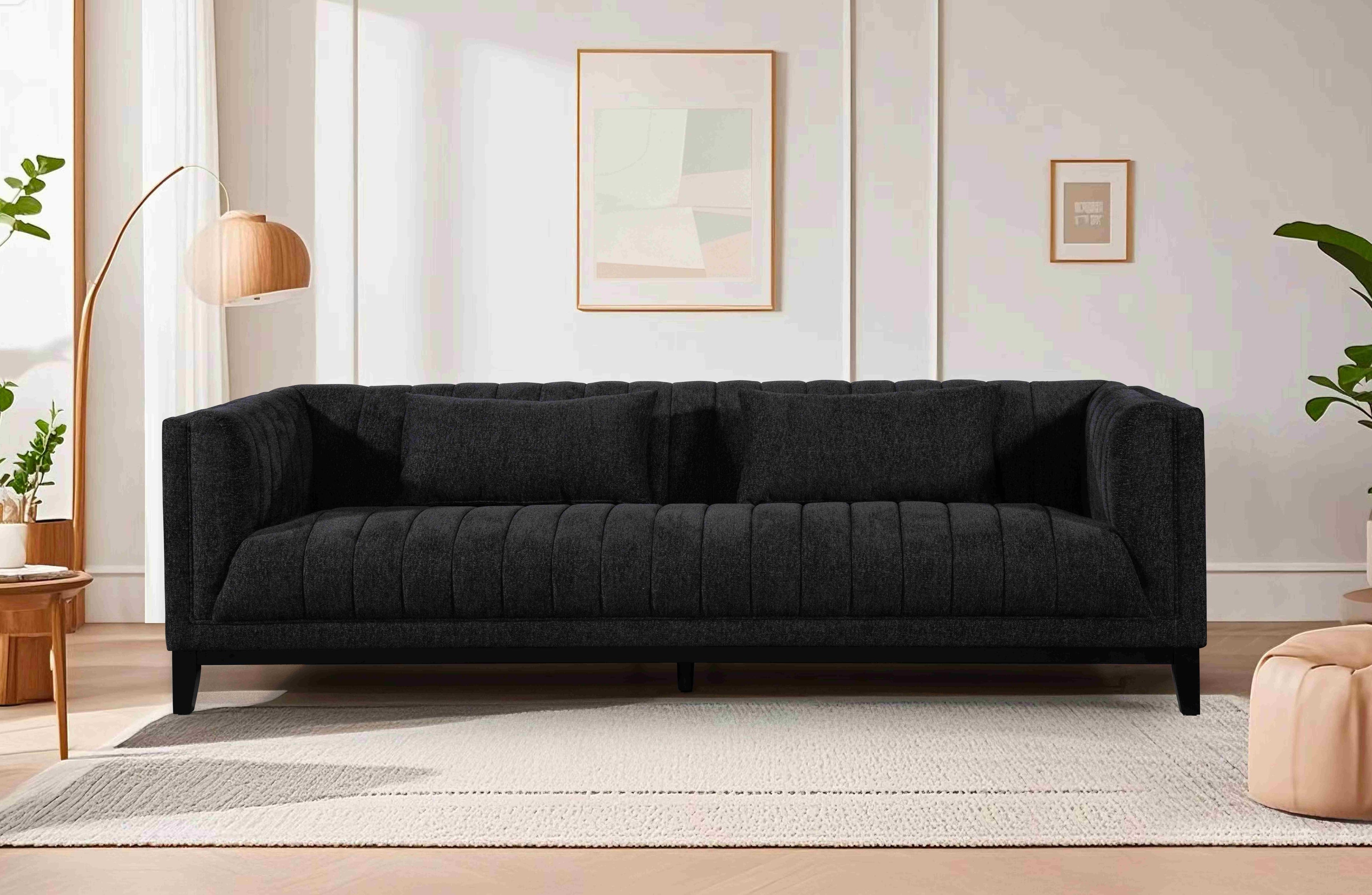 Austin Lounge Sofa in Charcoal – Contemporary 3-seater with deep tufting and plush cushions, styled in a light, airy modern living space.