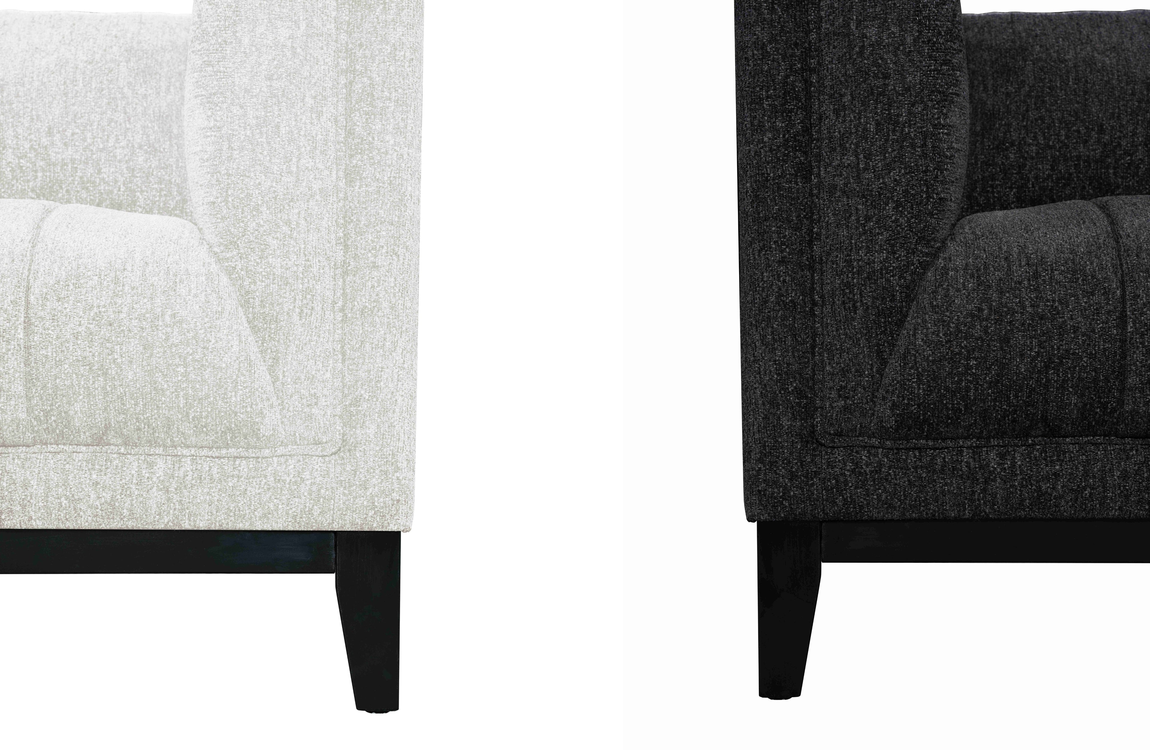 Austin Lounge Set detail view – Close-up of cream and black upholstery with premium textured fabric and solid wood legs in black finish.