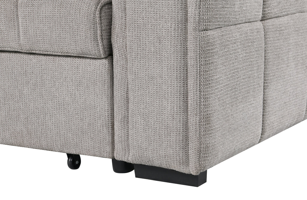 Close-up view of beige fabric sofa armrest and base, highlighting the textured upholstery, clean stitching, and sturdy black legs with rolling support wheel.