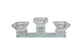 Elegant crystal-clear tea light candle holder with three diamond-shaped cups on a rectangular base.
