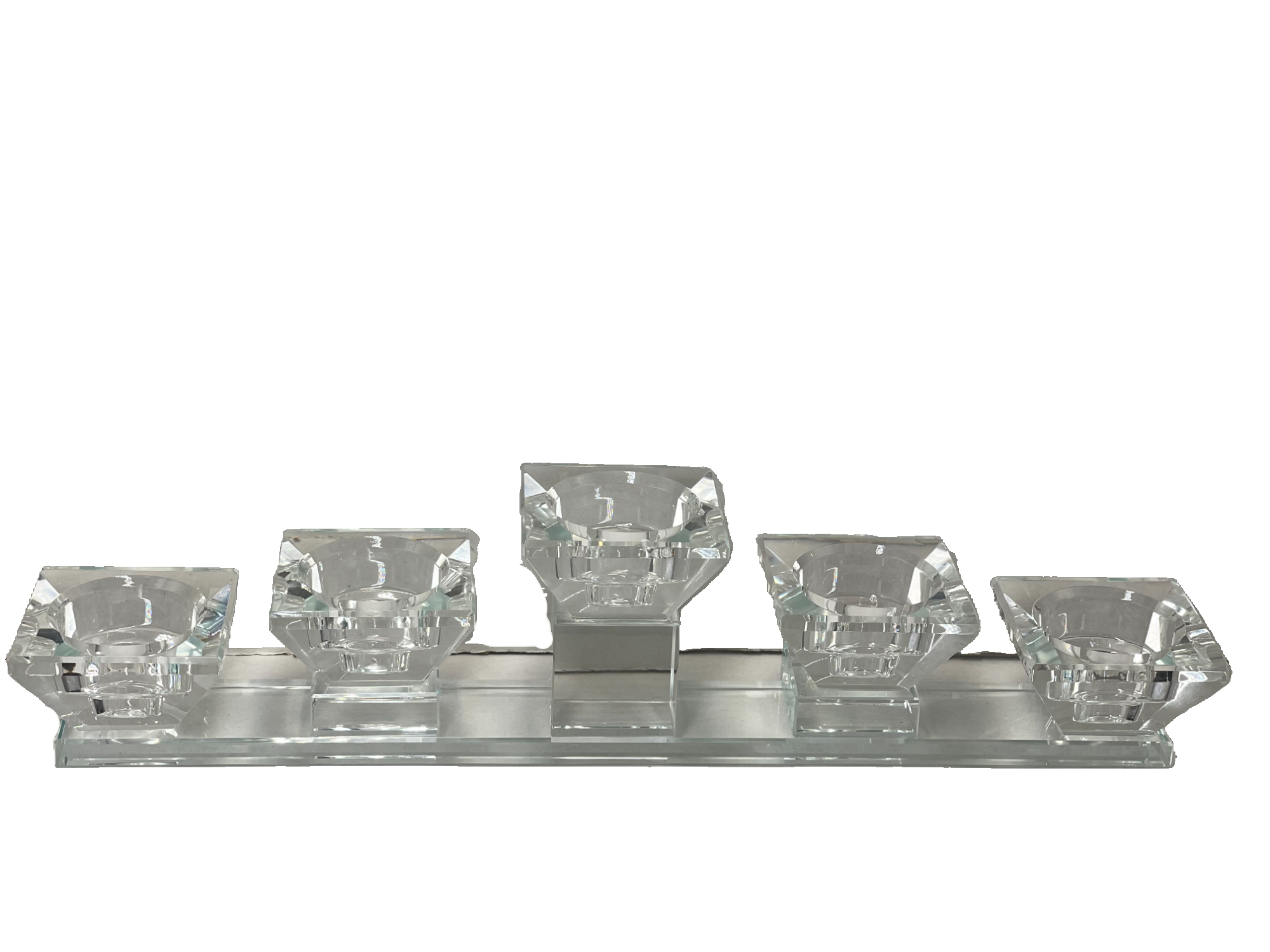 Elegant five-cup crystal tea light holder with faceted cups on a sleek rectangular base.