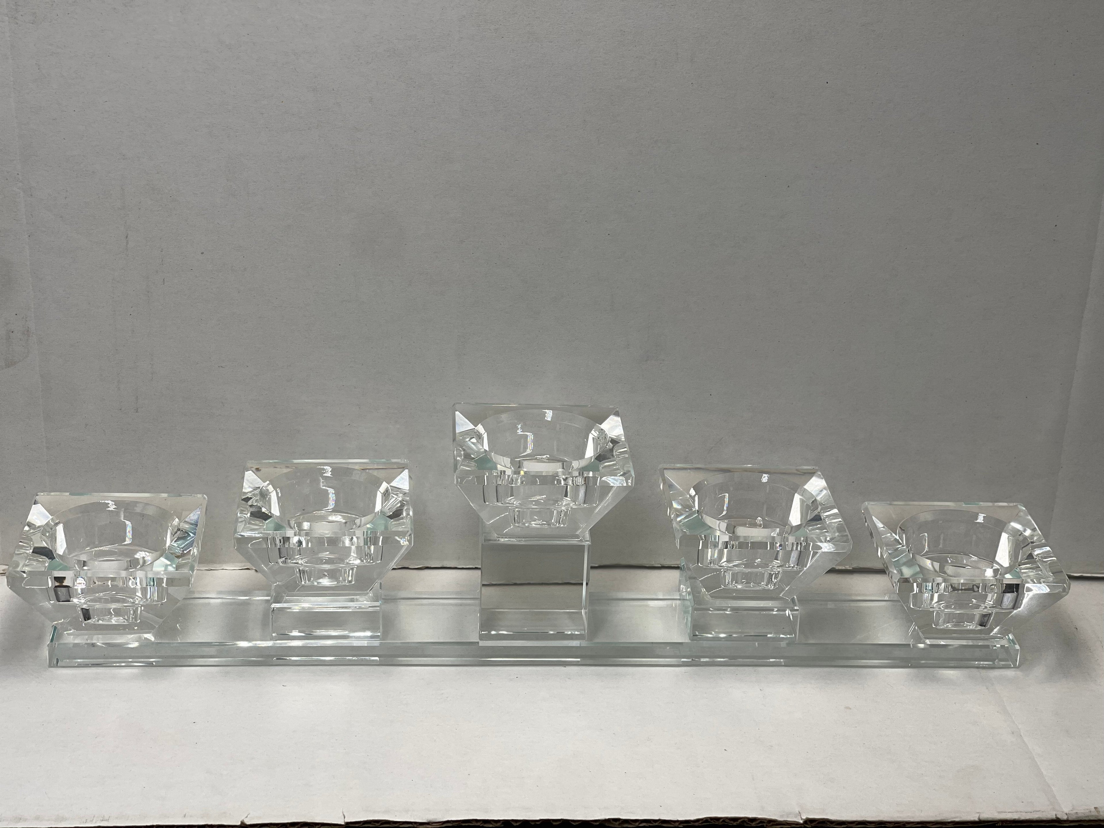 Crystal-clear tea light candle holder with five diamond-shaped cups on a long rectangular base