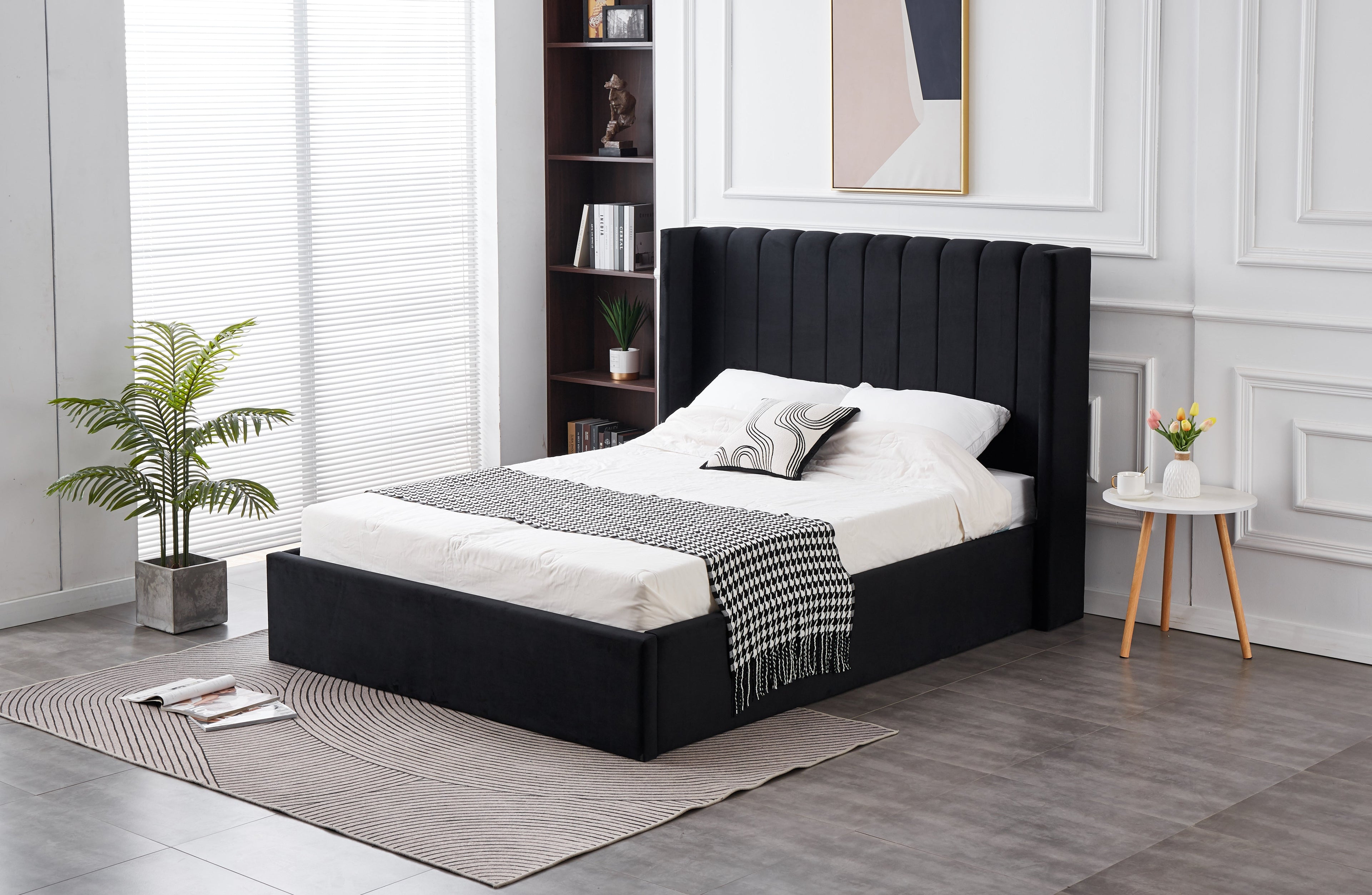 Hilton Velvet Gas Lift Bed in Black velvet, styled in a modern bedroom setting.