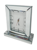 Elegant silver mirrored table clock with Roman numerals, perfect stylish décor accent piece.