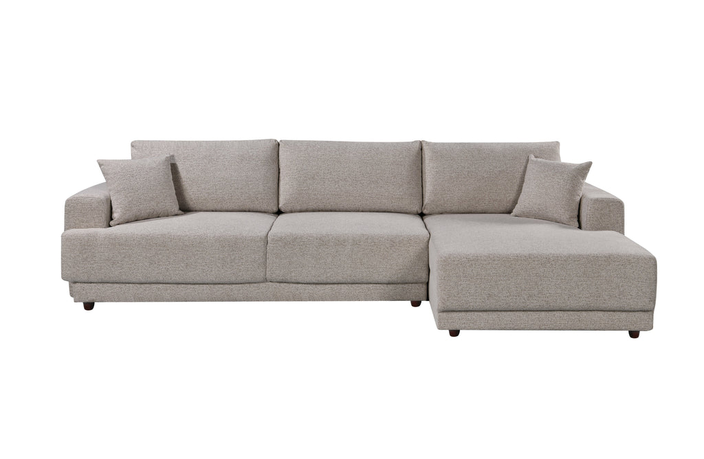 Beige 3-seater Nora sectional sofa with right-hand chaise, soft textured fabric and plush back cushions, shown on a white background.