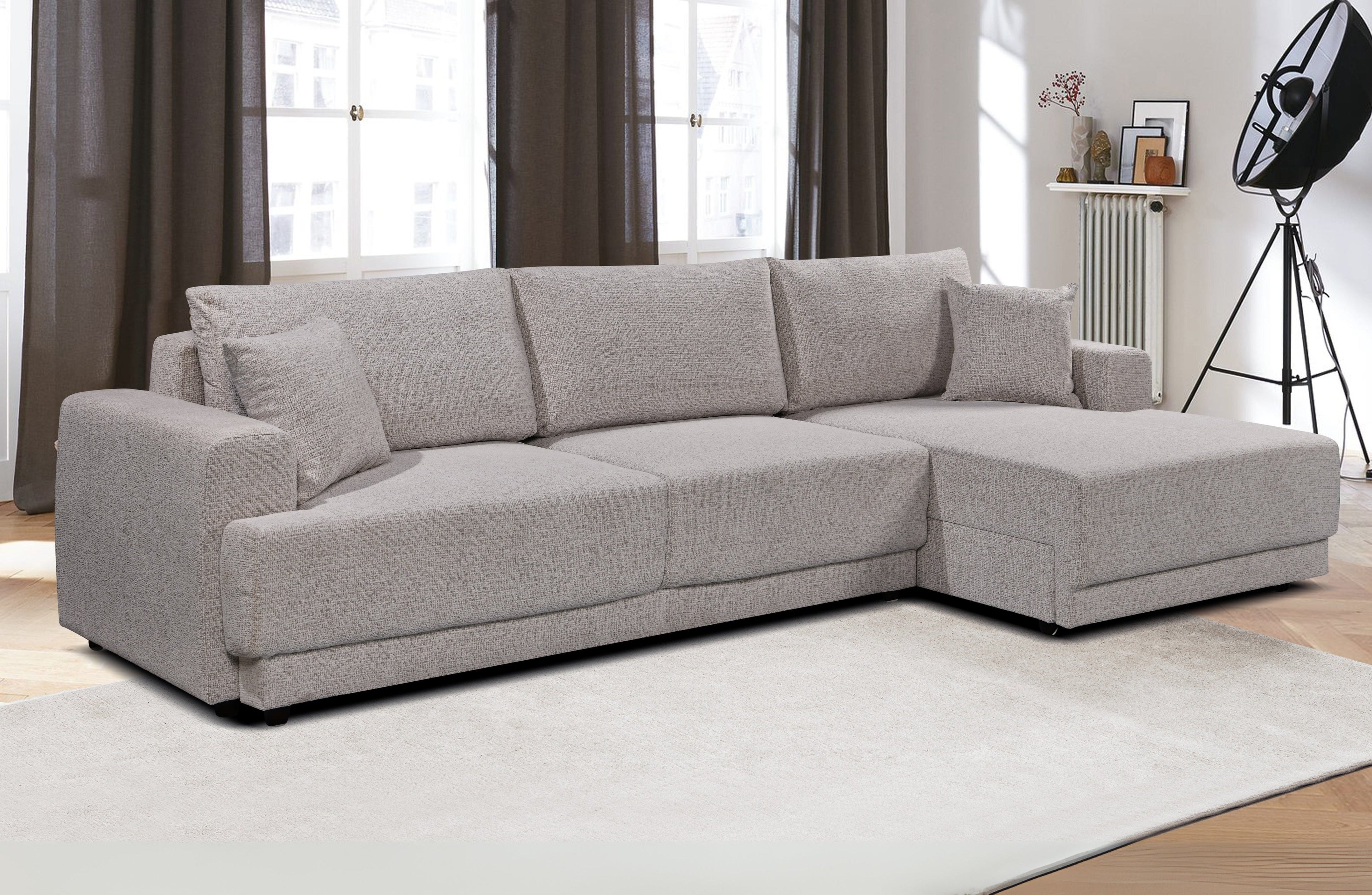 Luxe beige Nora chaise lounge sofa with pull-out bed – spacious sectional with hidden functionality for guests.
