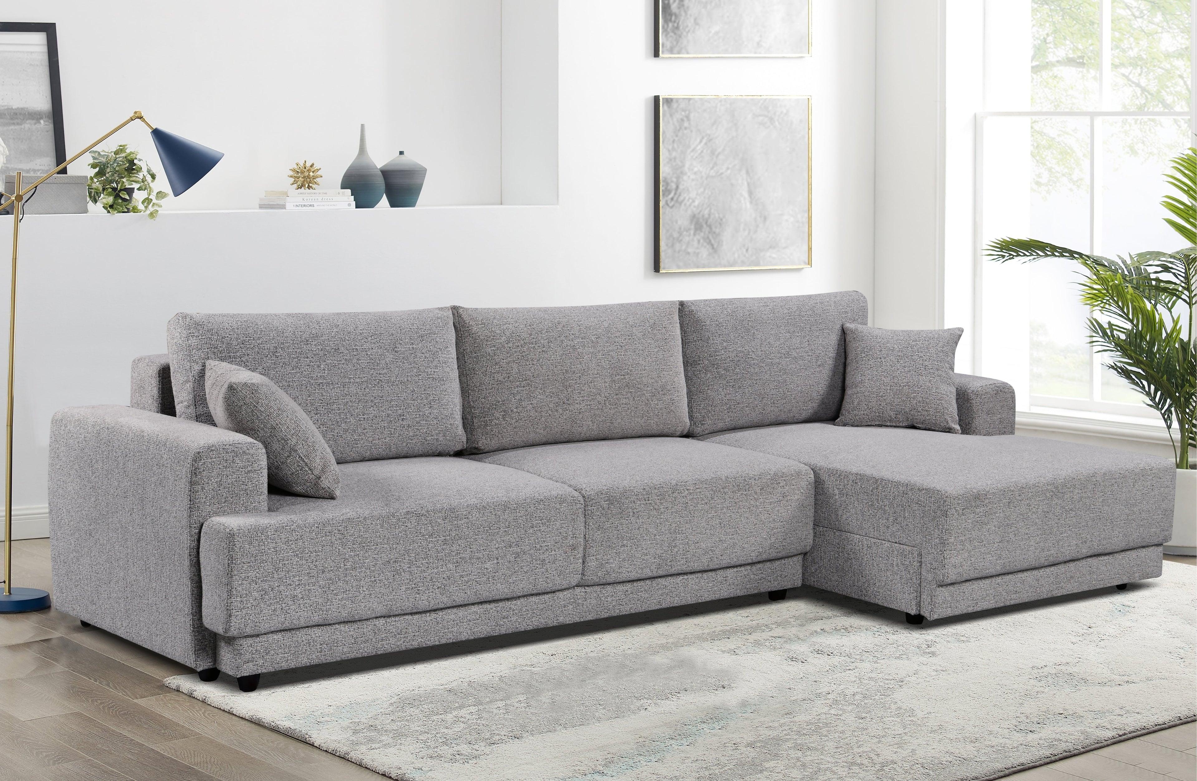 Sculpted grey Nora sectional with oversized chaise – effortlessly stylish with deep seats, clean lines, and high-end comfort