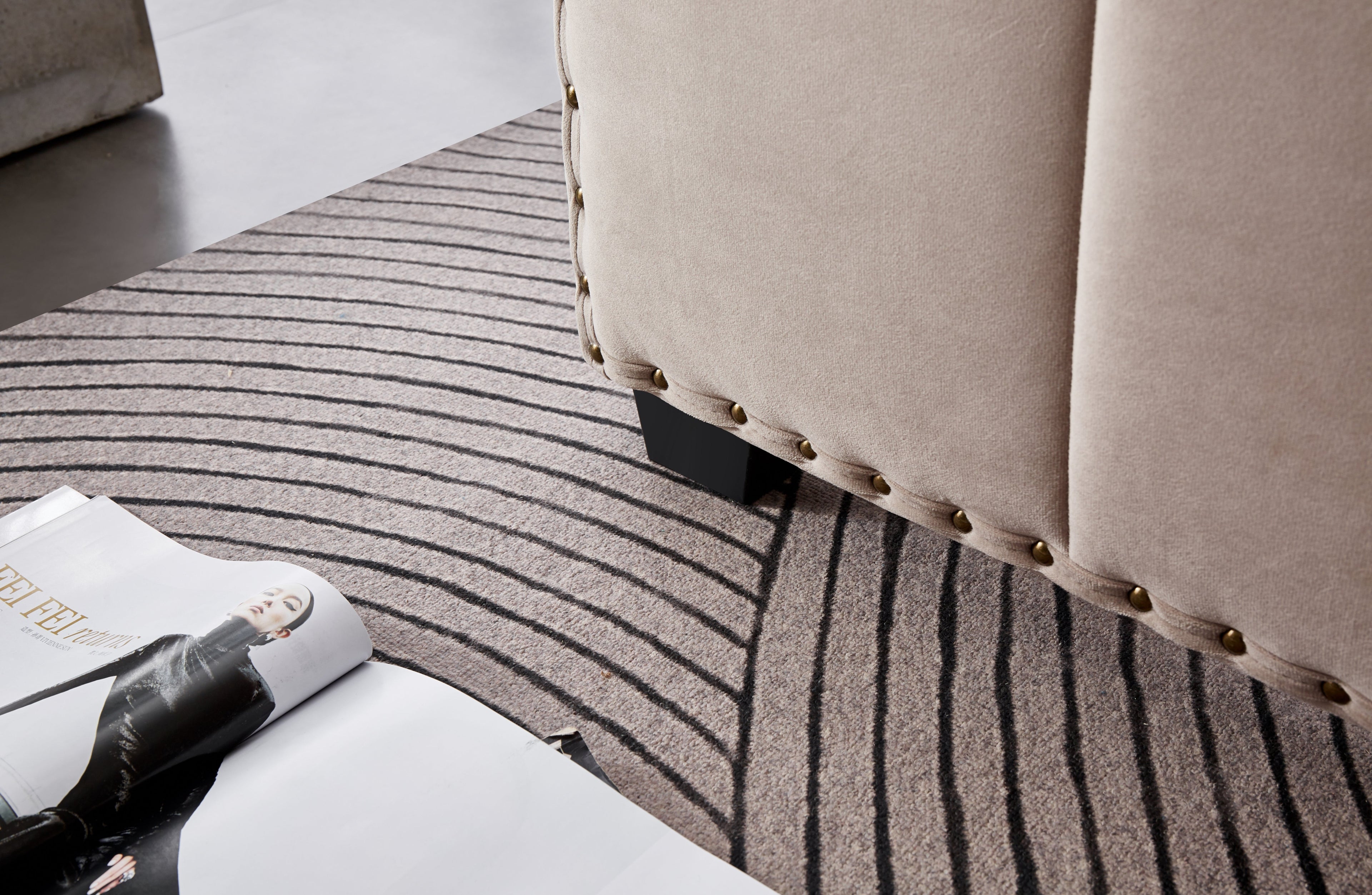 Detail view of Santosa Champagne Velvet Bed leg and stud finish.