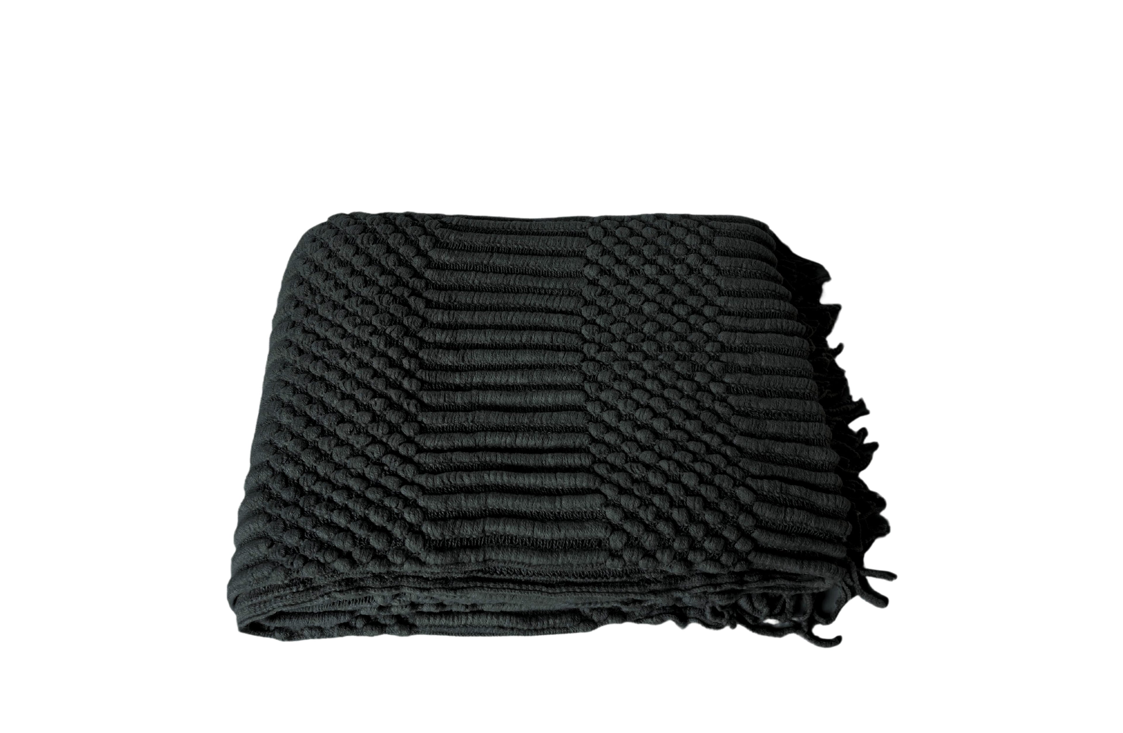 Black Tessa throw rug blanket with deep textured weave and fringed edges.