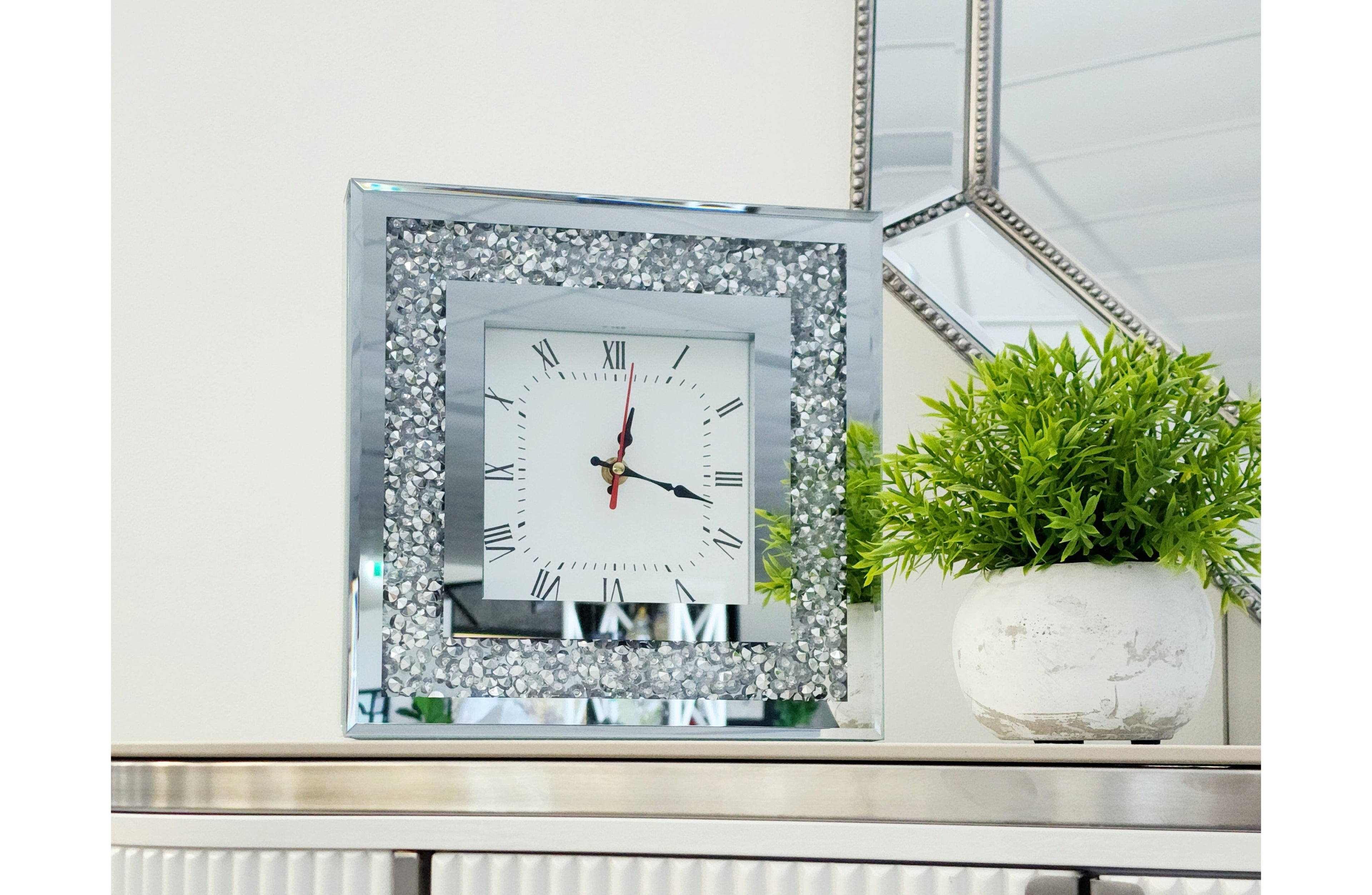 Stylish Vogue Diamond table clock displayed on console with plant, adding modern luxury charm.