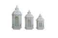White Metal Lantern Set of 3 – intricately designed lanterns in small, medium, and large sizes with glass panels and arched cut-outs