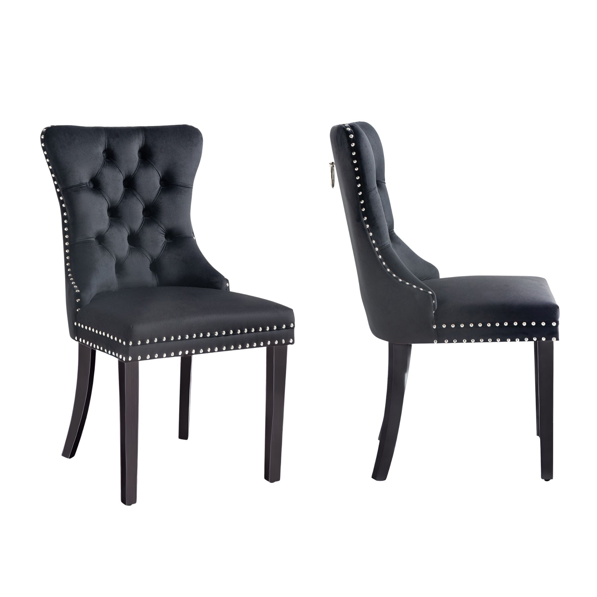 Pair of Alsea black velvet dining chairs with stud trim, tufted back, and pull-out ring.