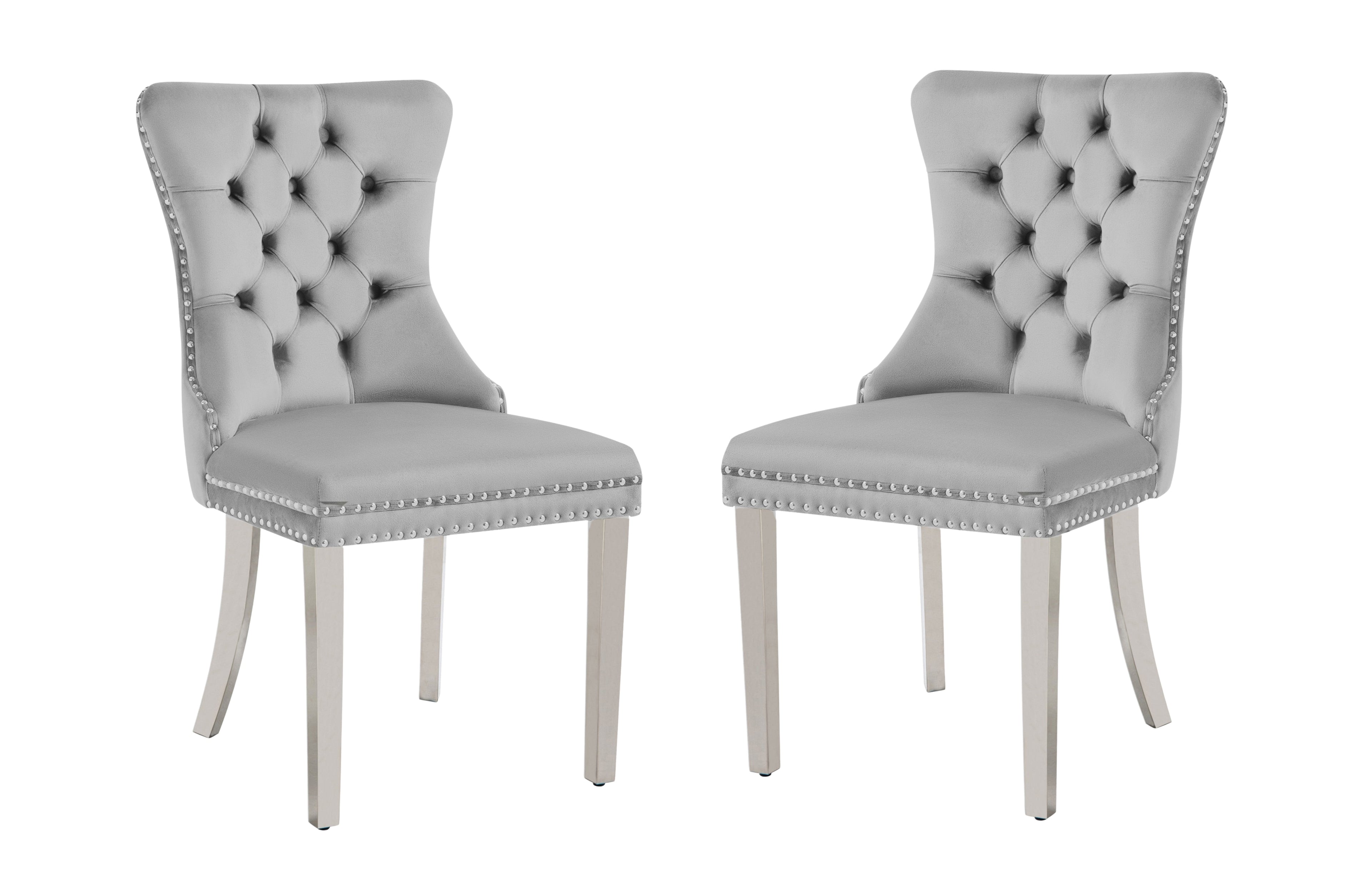 Alsea light grey velvet dining chair with tufted back, stud trim, ring handle, and silver legs.