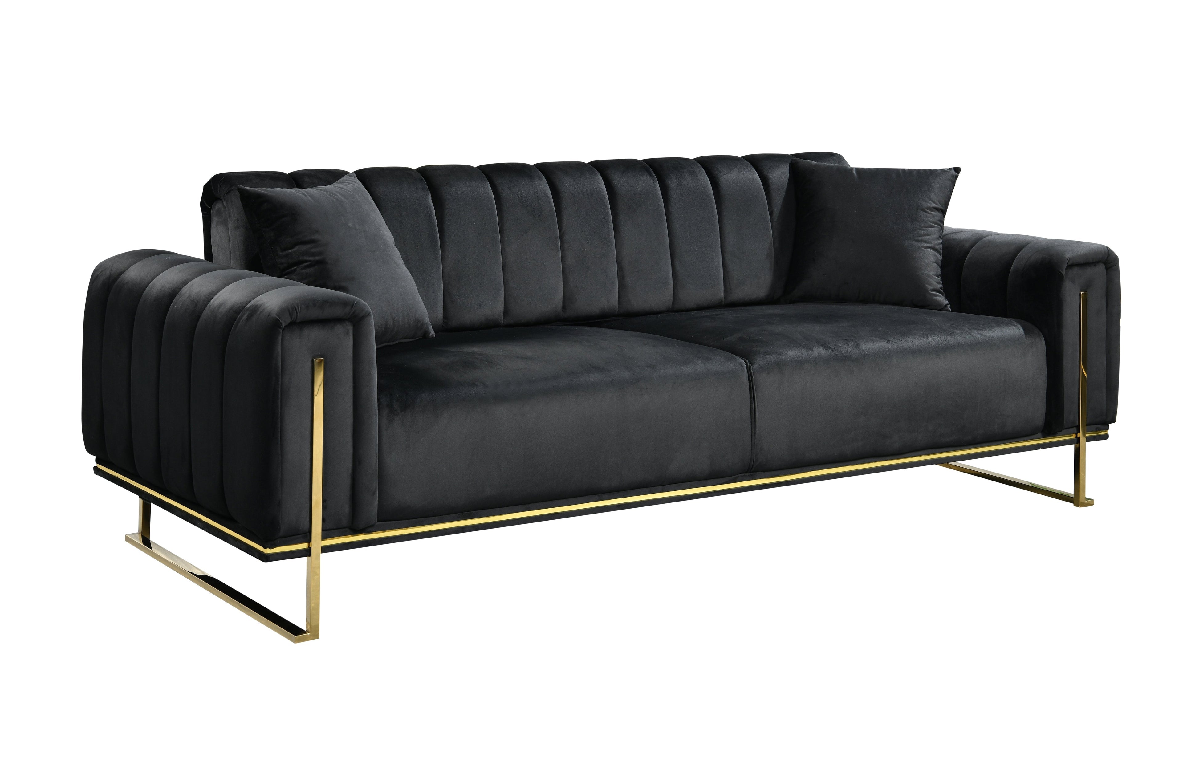 Bold black velvet three-seater sofa with statement gold trims and cushions