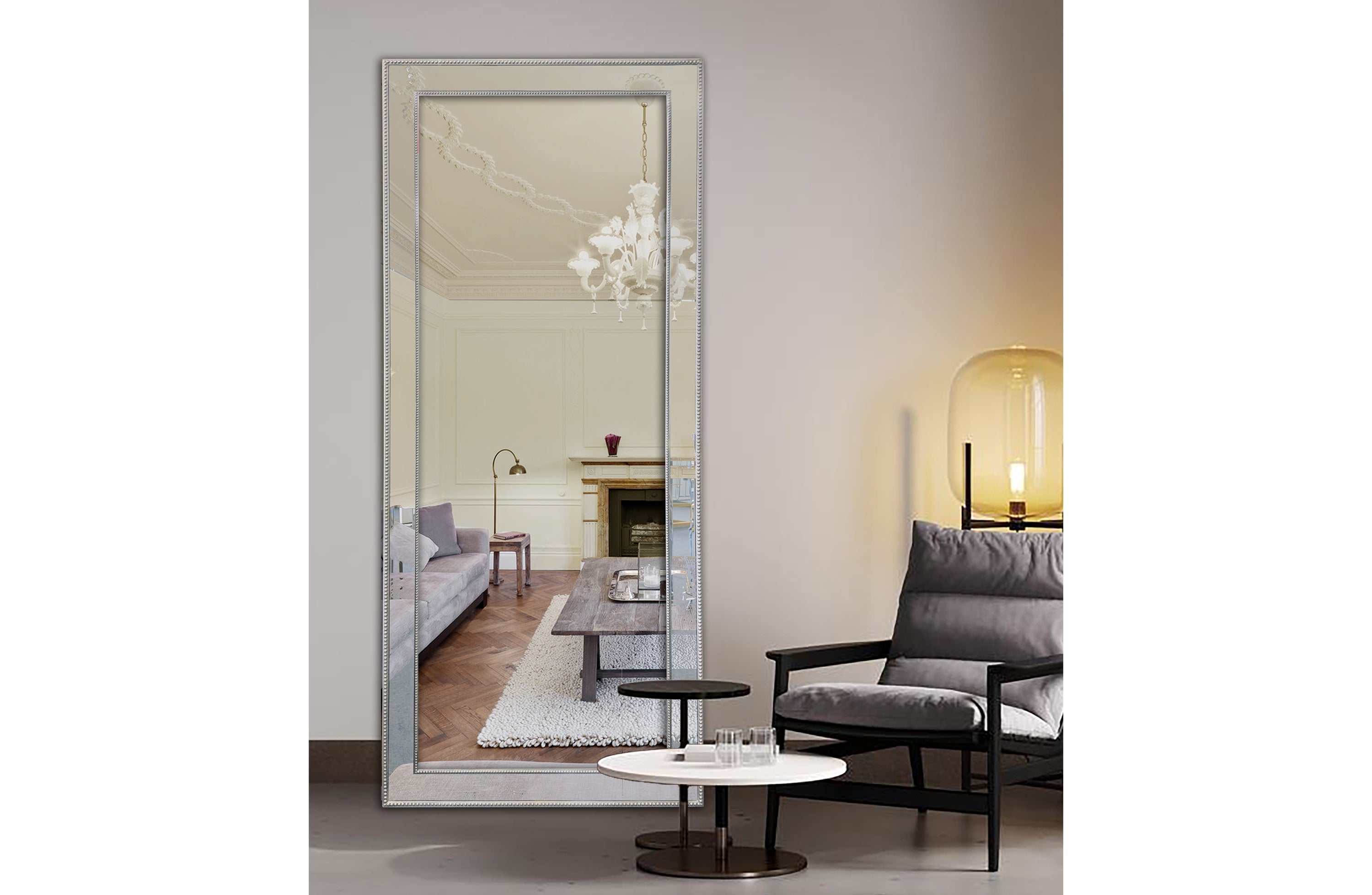 medium silver beaded framed mirror styled in modern living room interior.