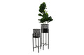 Black beehive planters in two sizes with lush green plants, photographed on a pure white background for a clean, modern look.