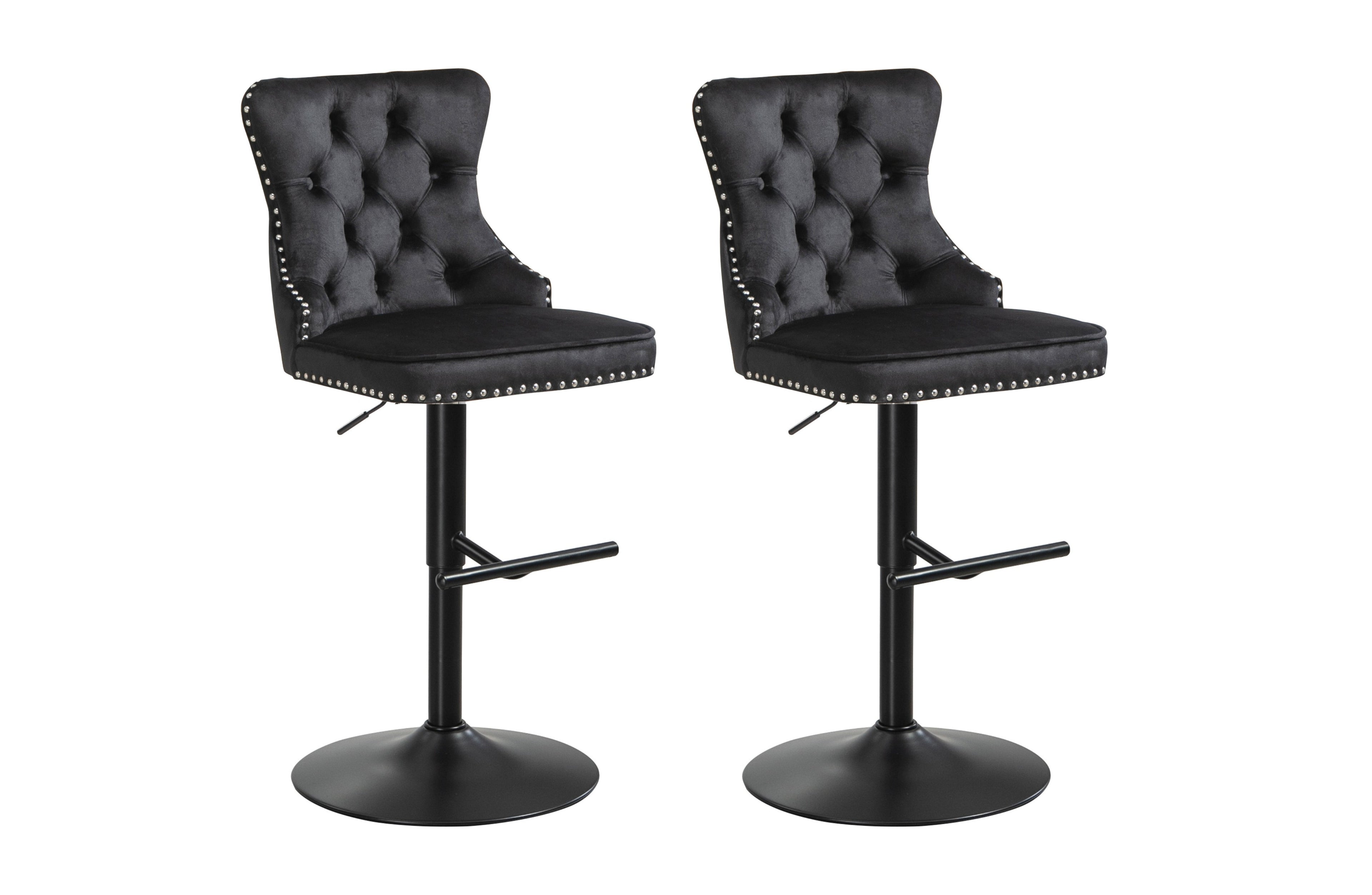 Pair of black velvet tufted swivel bar stools with stud trim and black metal base.