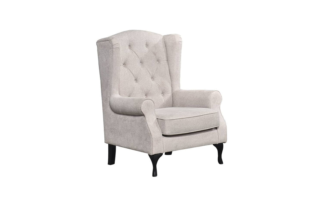 Beige Chesterfield tufted armchair with high back and studded details