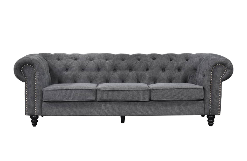 Charcoal grey Chesterfield tufted three-seater lounge with elegant rolled arms