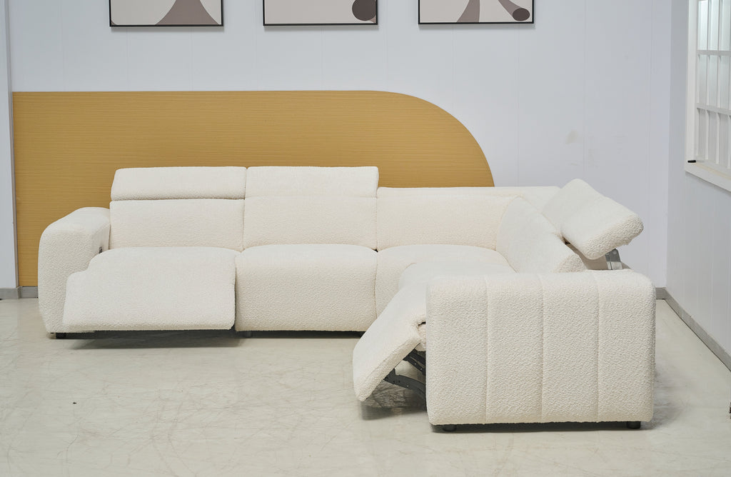Cream Cleo boucle modular lounge styled in modern room with electric recliners extended forward.