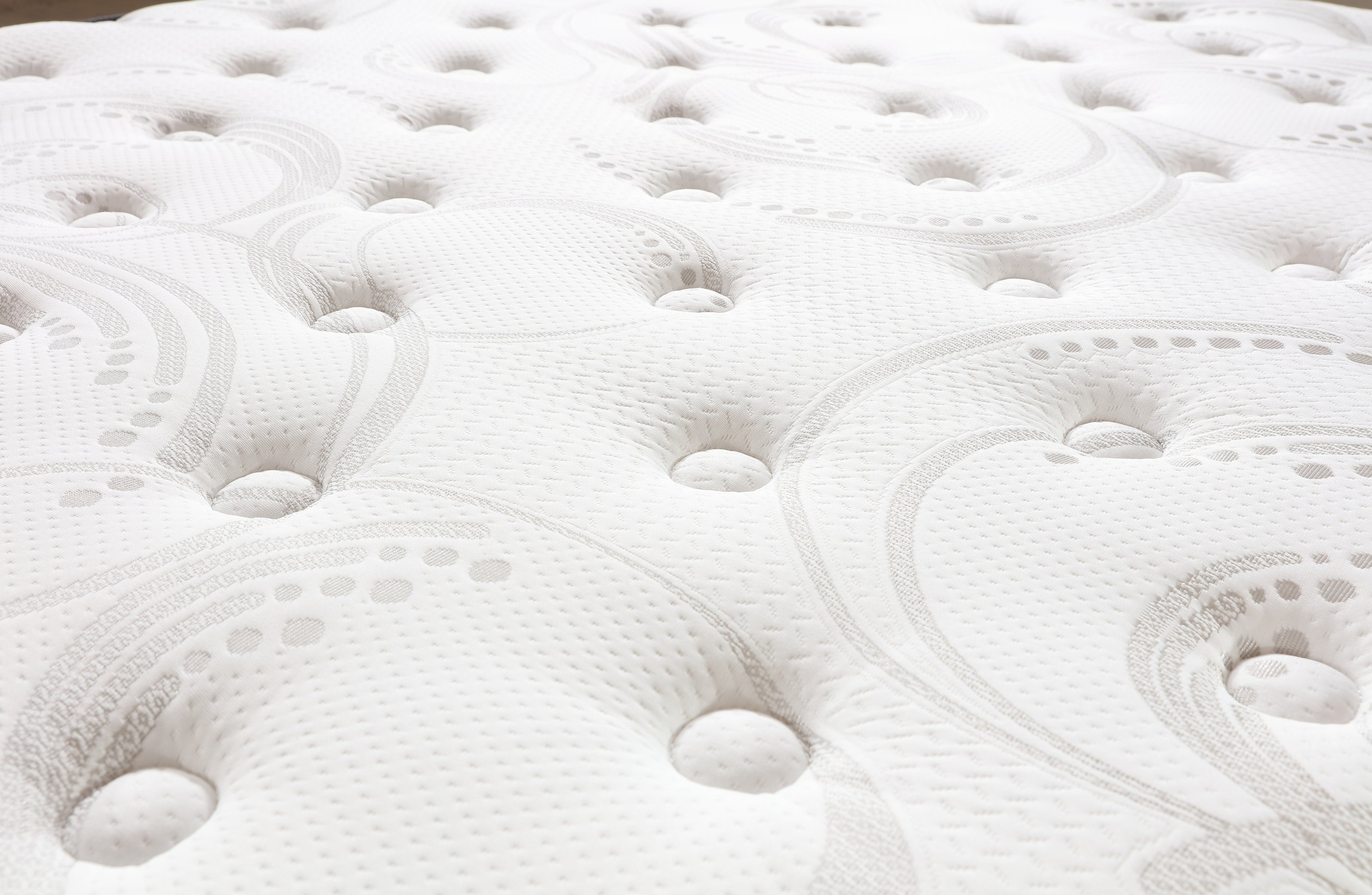 Close-up of Comfort Euro Top mattress surface showing breathable knitted fabric texture.