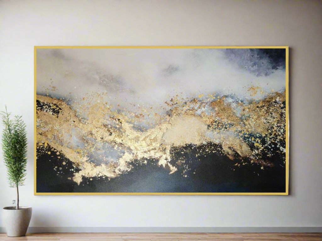 Gold and blue abstract wall art in gold frame displayed in modern interior setting.