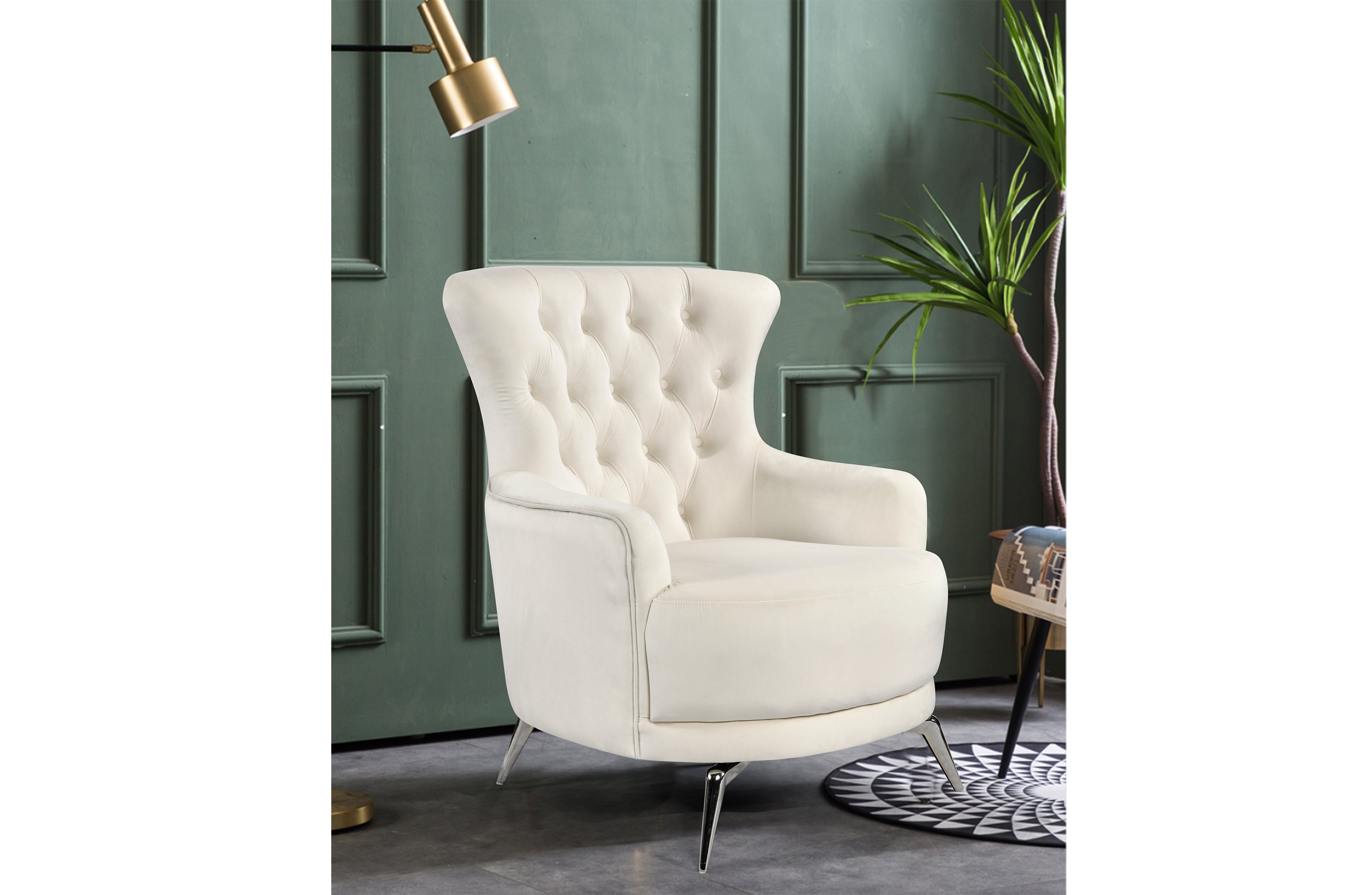GRAND beige velvet tufted wing chair with silver legs styled in modern interior