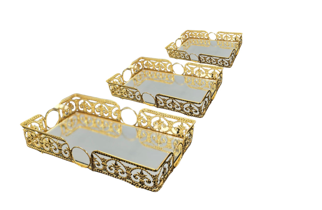 Set of 3 gold rectangle Lucy trays with ornate cut-out edges and mirrored bases – classic elegance for serving or display.