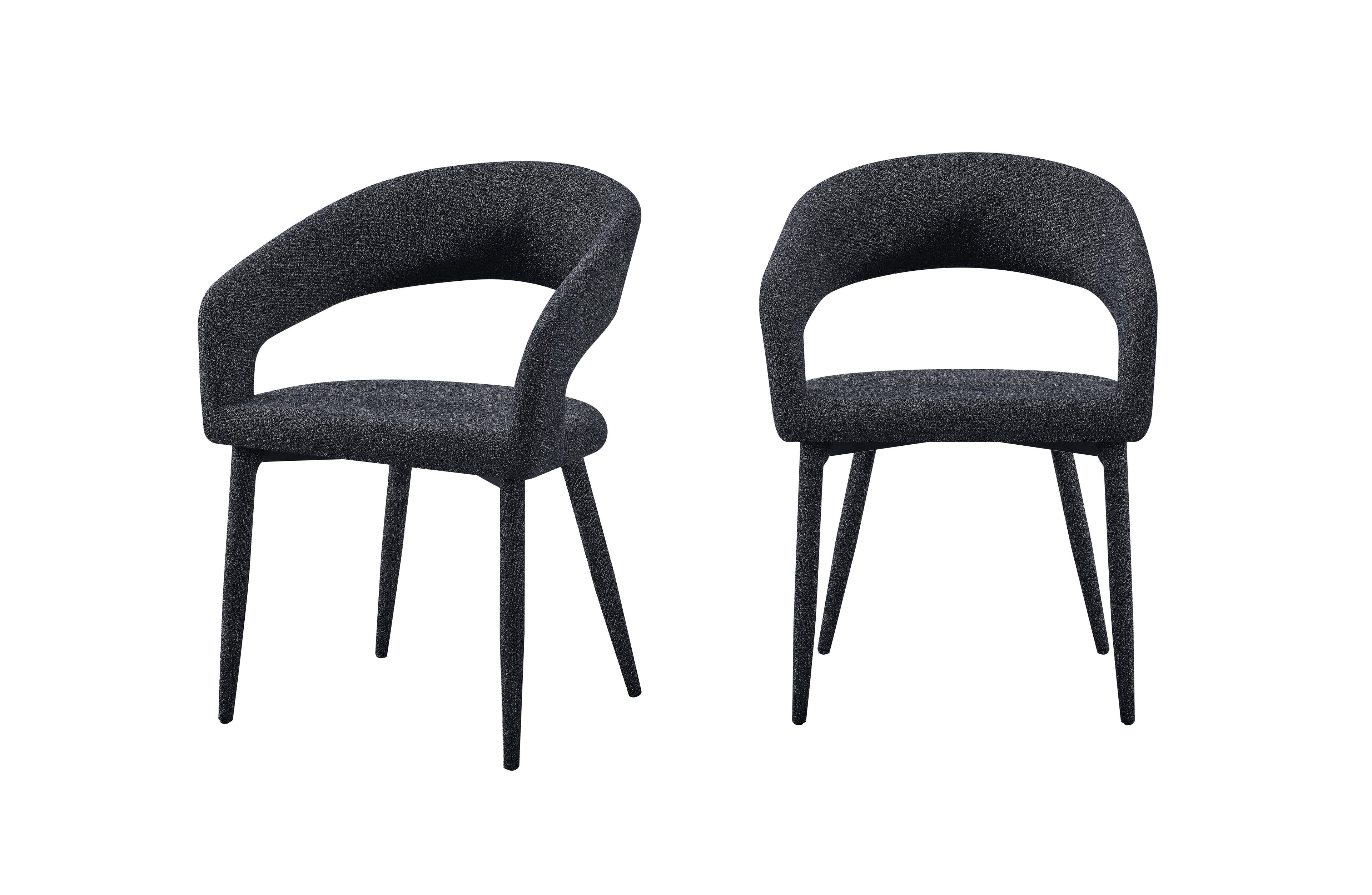 Set of 2 Marilyn boucle dining chairs in charcoal fabric with curved open back and black legs.