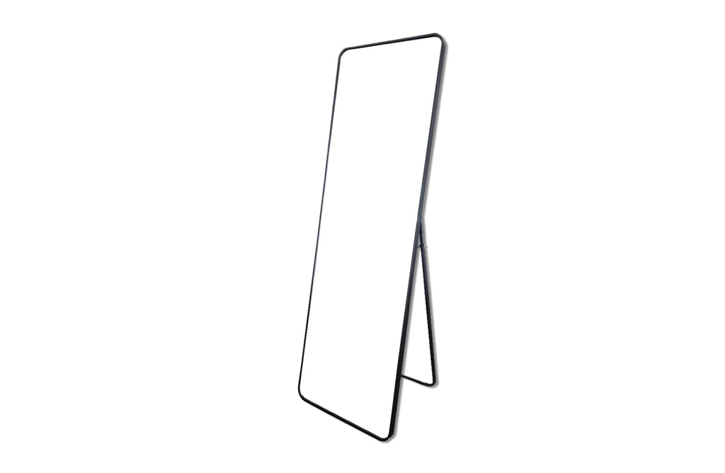 Product view of free standing black metal rectangle mirror with minimal frame and angled support.