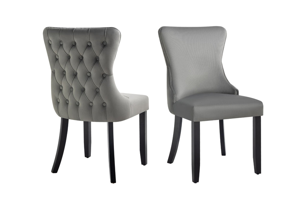 Grey velvet Paris dining chairs with tufted back and elegant rubberwood frame.