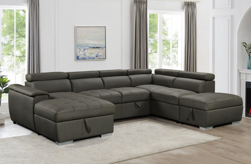 Charcoal grey plush modular chaise lounge styled in living room with sofa bed and storage.