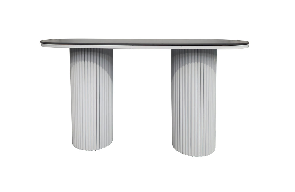Ripple console table with black sintered stone marble top and white fluted legs.
