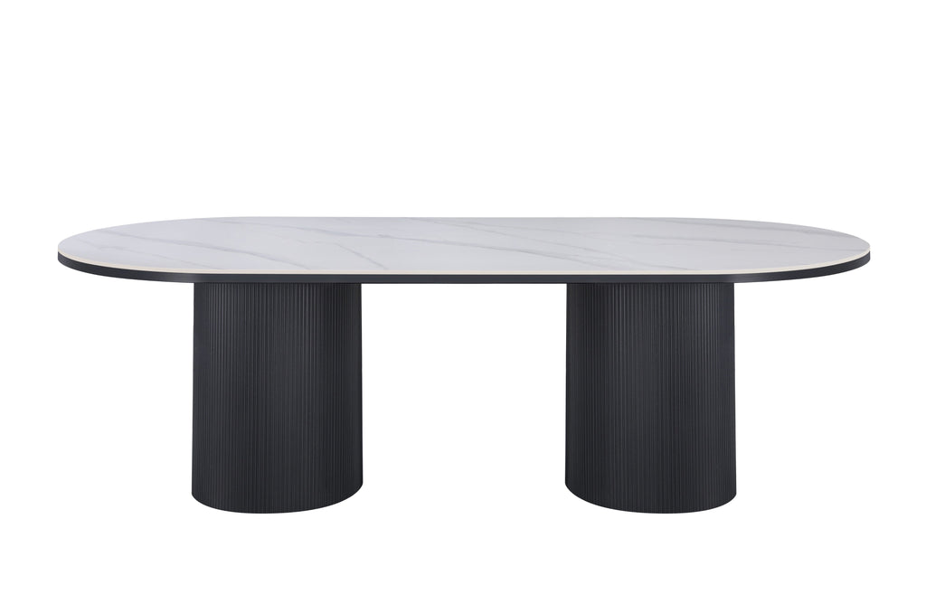 Ripple Oval Dining Table with white marble top and black base in modern style.