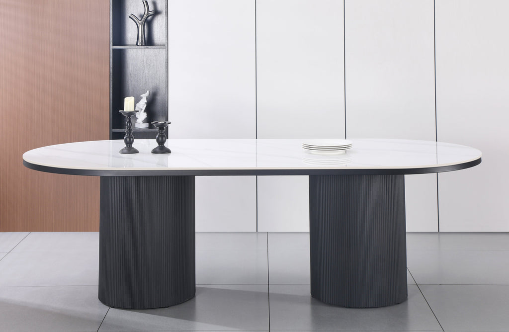 Ripple Oval Dining Table with white marble top styled in elegant modern dining space.