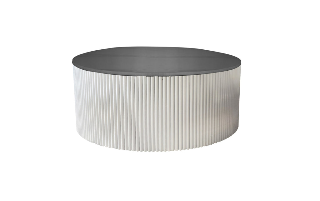 Ripple round white coffee table with ribbed body and black top