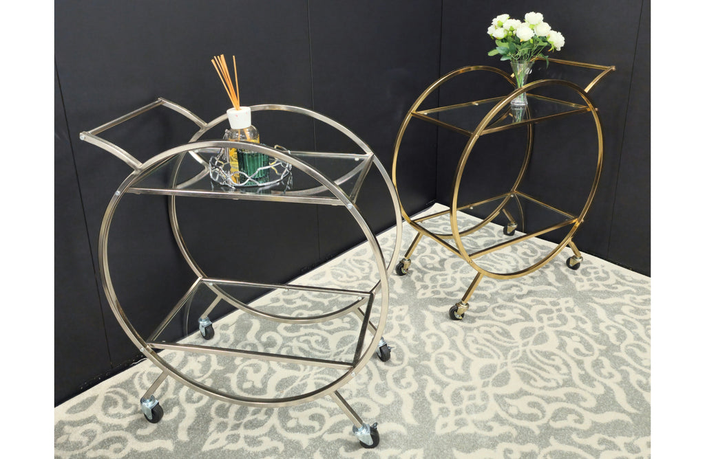 Roman trolleys styled with décor in modern black and gold tones.