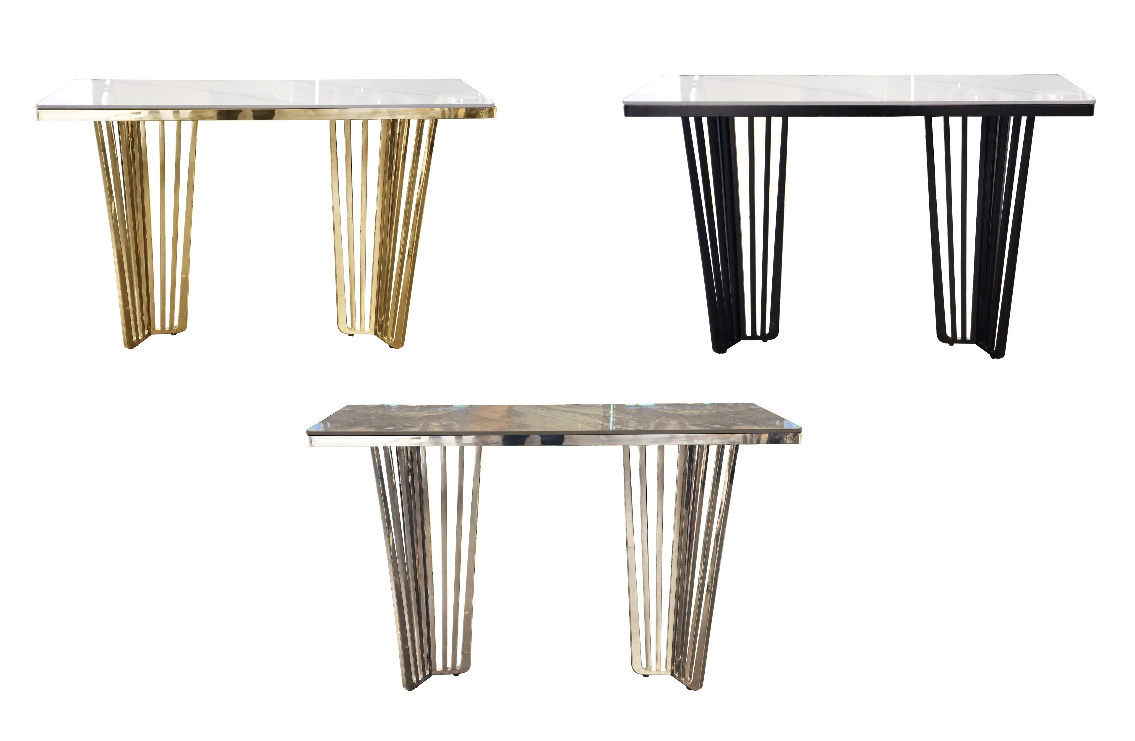 Serena console table collection in gold, silver, and black frames with marble tops.